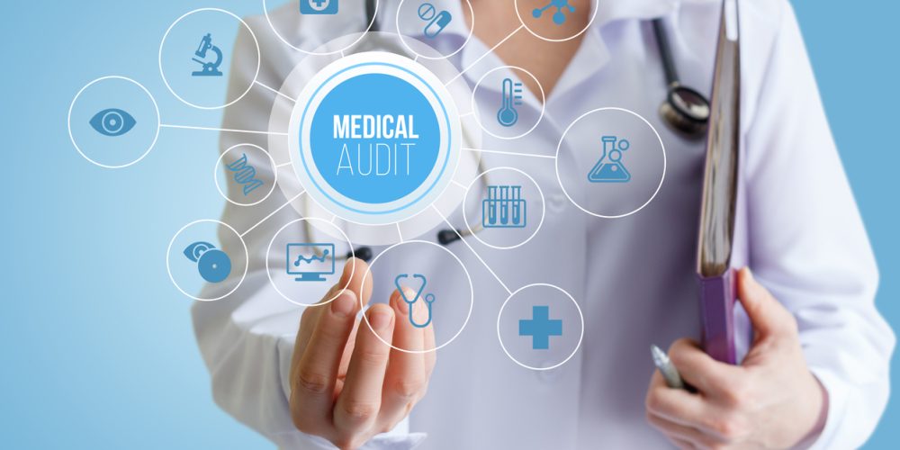 Doctor holding a medical audit concept design.